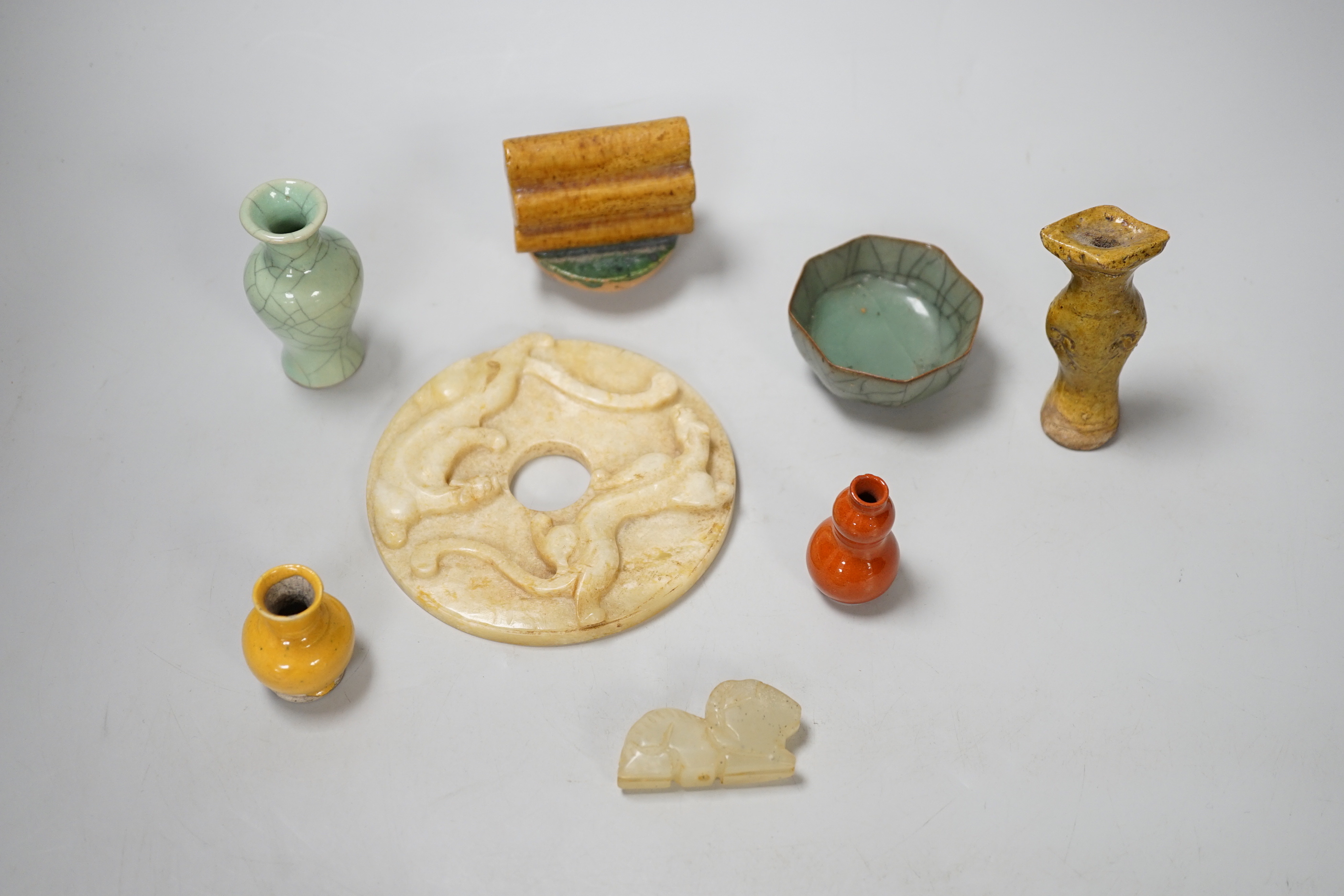A group of Chinese small ceramics and a hardstone bi disc- 10.5 cm diameter